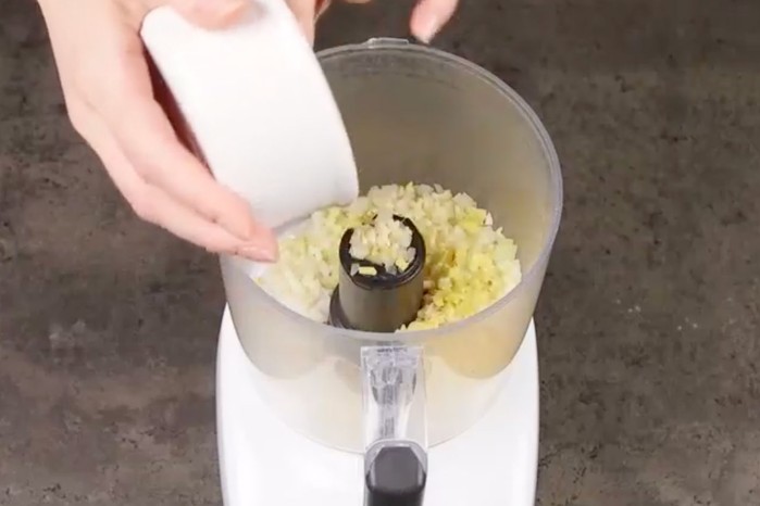 Aromatics being added to a food processor