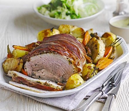 Herb roast pork with vegetable roasties & apple gravy recipe