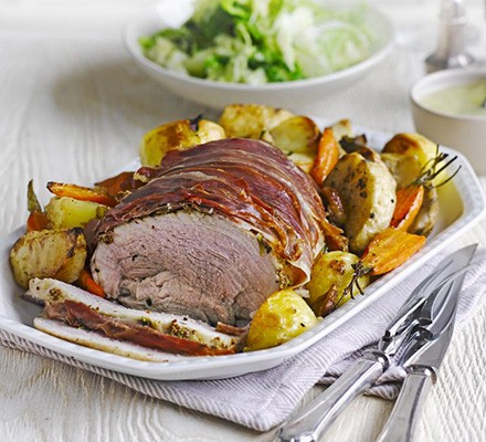Herb roast pork with vegetable roasties & apple gravy recipe 
