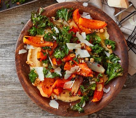 Soft polenta with roast squash, kale & hazelnuts recipe