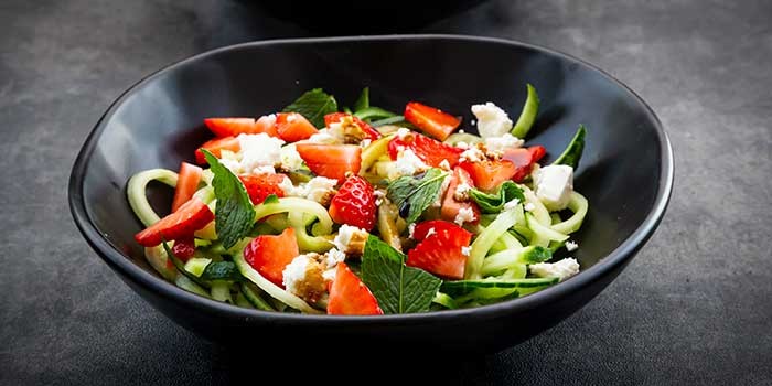 A cucumber and strawberry salad