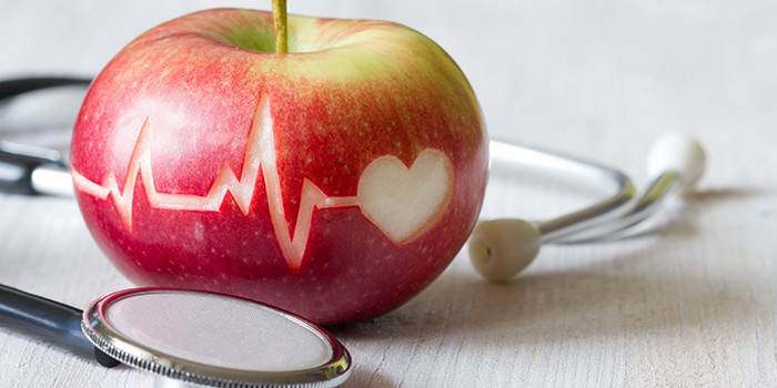 Medical ECG line carved into an apple