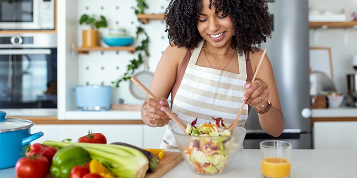 A young woman preparing a healthy meal