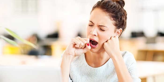 A woman yawning