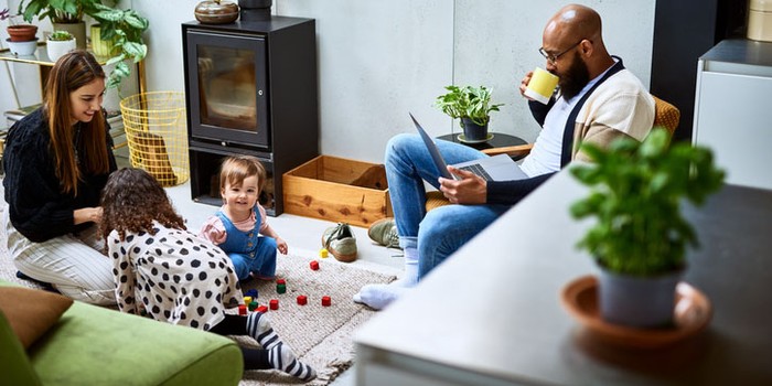 Mother and father at home wit h two daughters