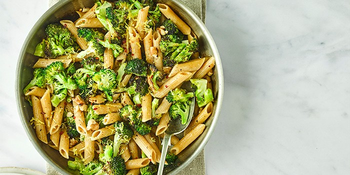 Charred broccoli, lemon and walnut pasta in a serving dish