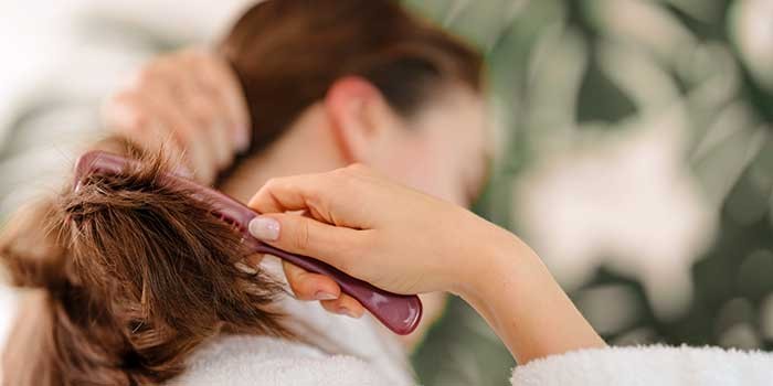 A woman brushing her hair