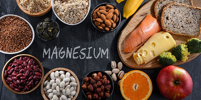 A sign reading 'Magnesium' with foods surrounding it