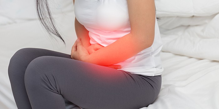 Woman with stomach cramps
