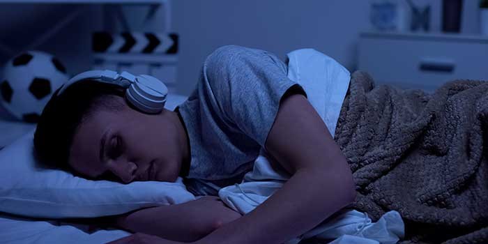 Listening to music trying to promote sleep