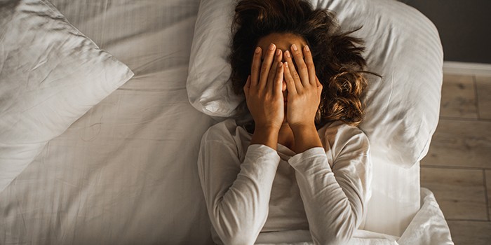 Woman struggling to sleep