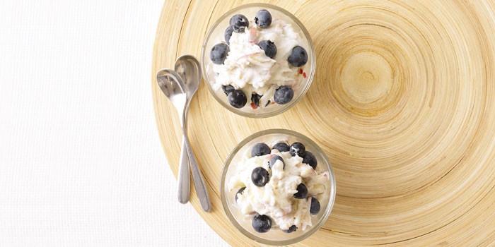 Bircher pots with spoons on board