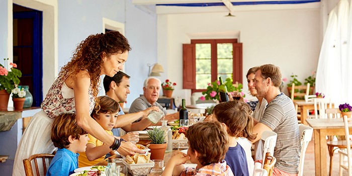 A family enjoying a meal together around the dining table