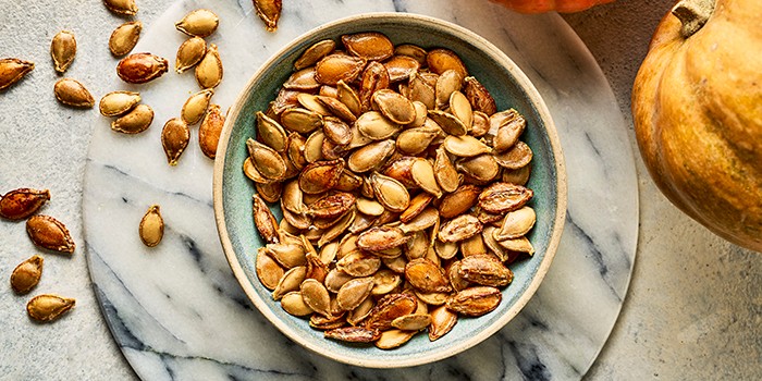 Roasted pumpkin seeds in a bowl