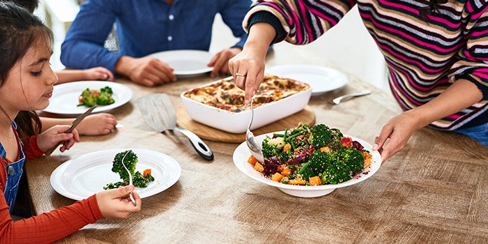 Child eating healthy food at table