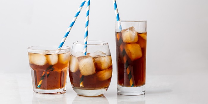 Three different glasses of cola