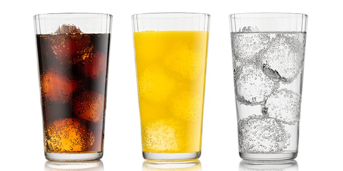 Three tall glasses of different fizzy drinks