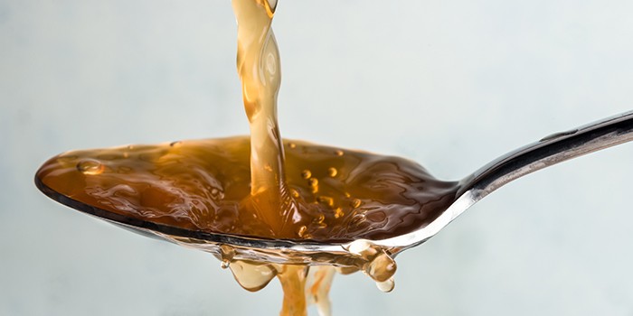 Apple cider vinegar on a spoon