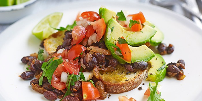 Black beans, tomatoes and avocado on toast