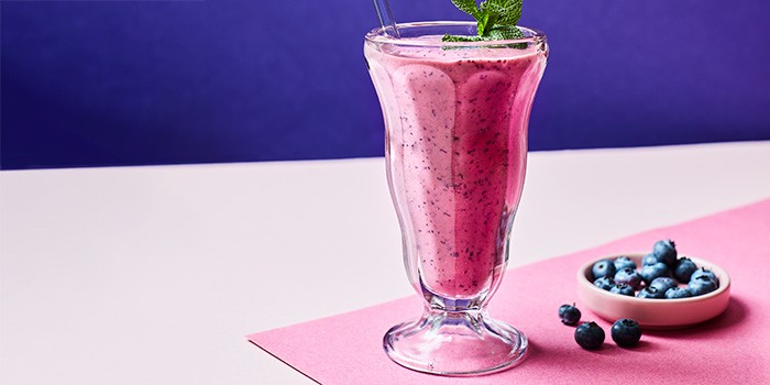 Blueberry smoothie in a tall glass