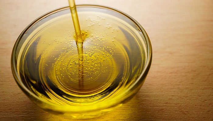 Glass bowl of olive oil