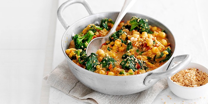 Chickpea, tomato and spinach curry in a silver pan