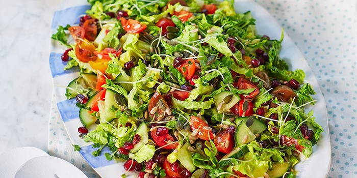Crunchy chopped salad with tomatoes, cucumber and lettuce