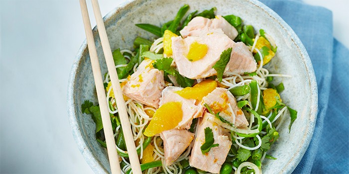 Fresh salmon with Thai noodle salad with chopsticks