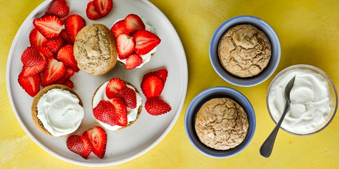 Plate of scones with strawberries and yoghurt