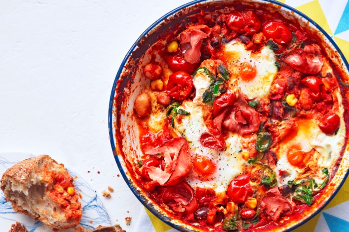 Pan of eggs with tomatoes and pepper