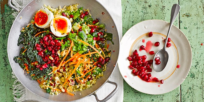 Kale & bulgur tabbouleh with yogurt dressing, boiled egg and pomegranate seeds