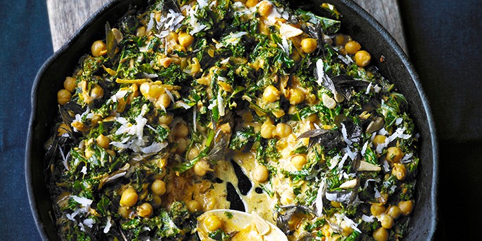Kale with chana & coconut in a frying pan