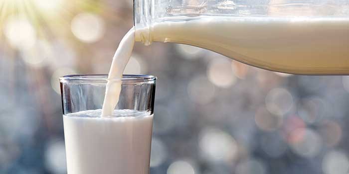 Milk being poured into a glass