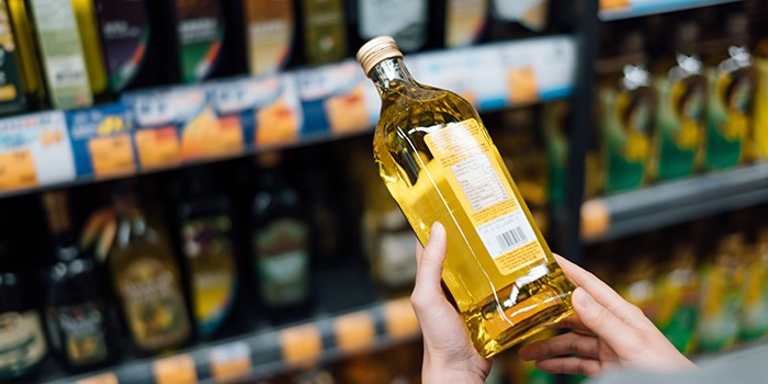 Reading the back of olive oil bottle
