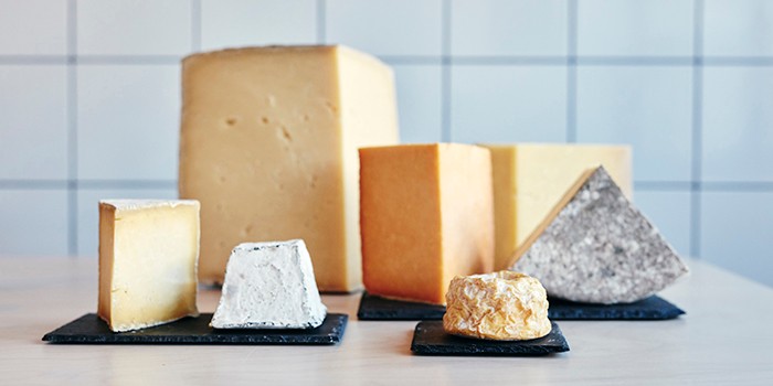 Range of cheeses on table top