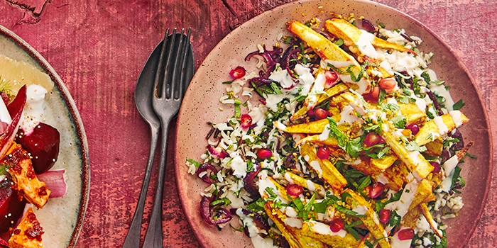 Sesame parsnip & wild rice tabbouleh on a pink plate