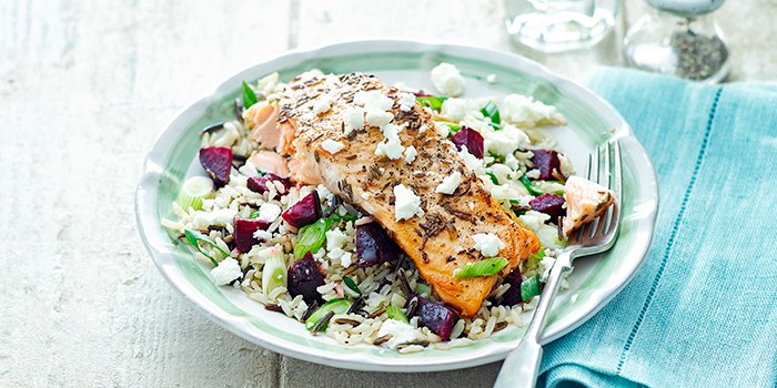 Spiced salmon with beetroot, feta & wild rice with a fork