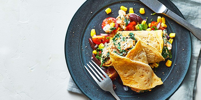 Spinach and tuna pancakes with sweetcorn, tomatoes and beans