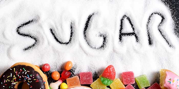 The word 'sugar' written into sugar grains