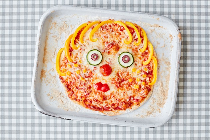 Pizza made to look like a face