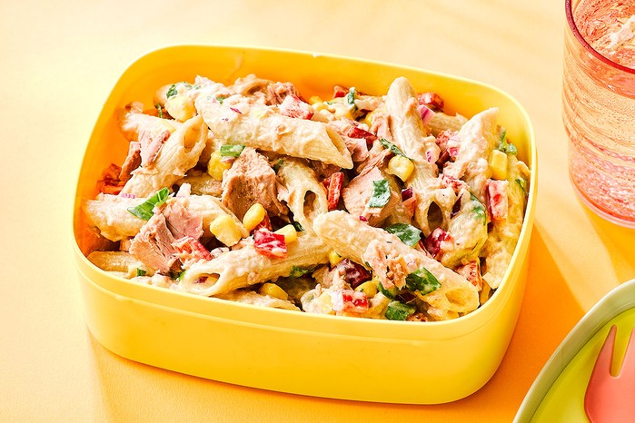 Pasta salad in yellow storage container