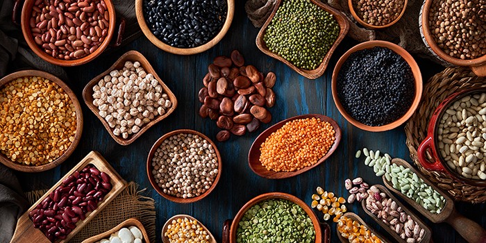 Legumes and beans on a rustic wooden table