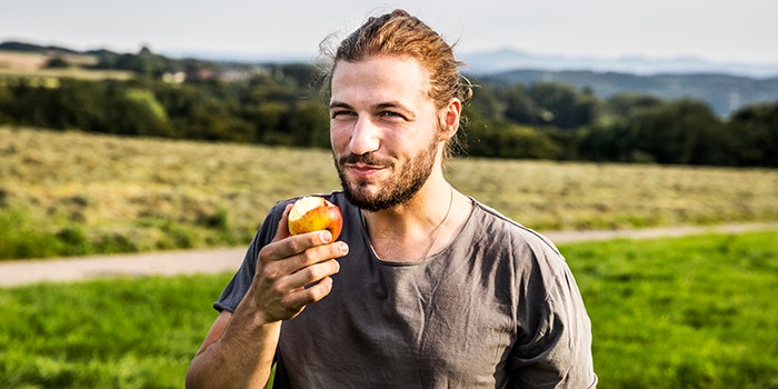 Man eating an apple