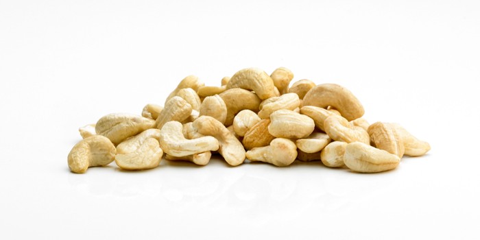 pile of cashews on a white background