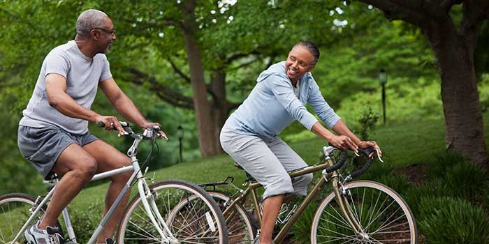 An older couple cycling together