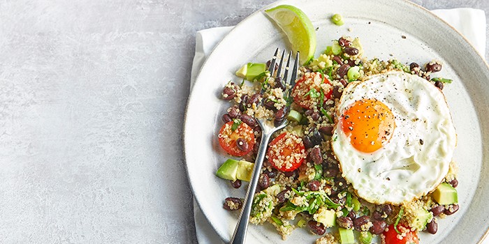 South American-style quinoa with eggs and a wedge of fresh lime
