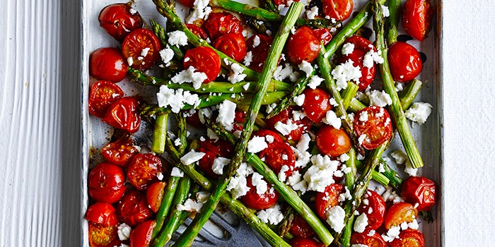 roasted balsamic asparagus and cherry tomatoes on a tray
