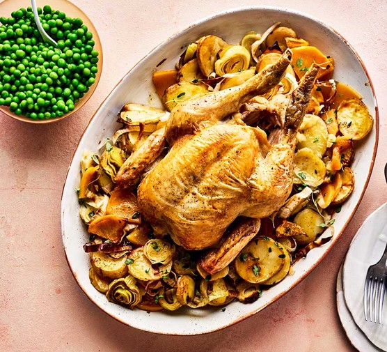 Whole roast chicken with braised roots & peas recipe 