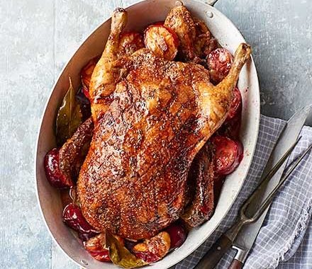Roast spiced duck with plums recipe