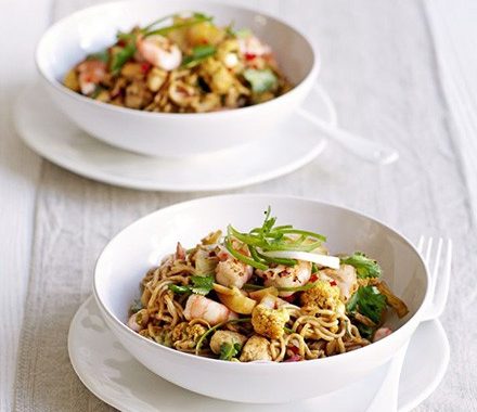 Spiced Singapore noodles with cauliflower, chicken & prawns recipe